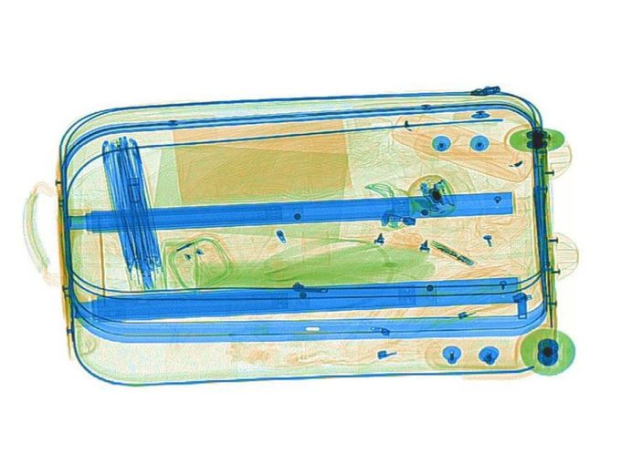 X-ray image of a suitcase and its contents.